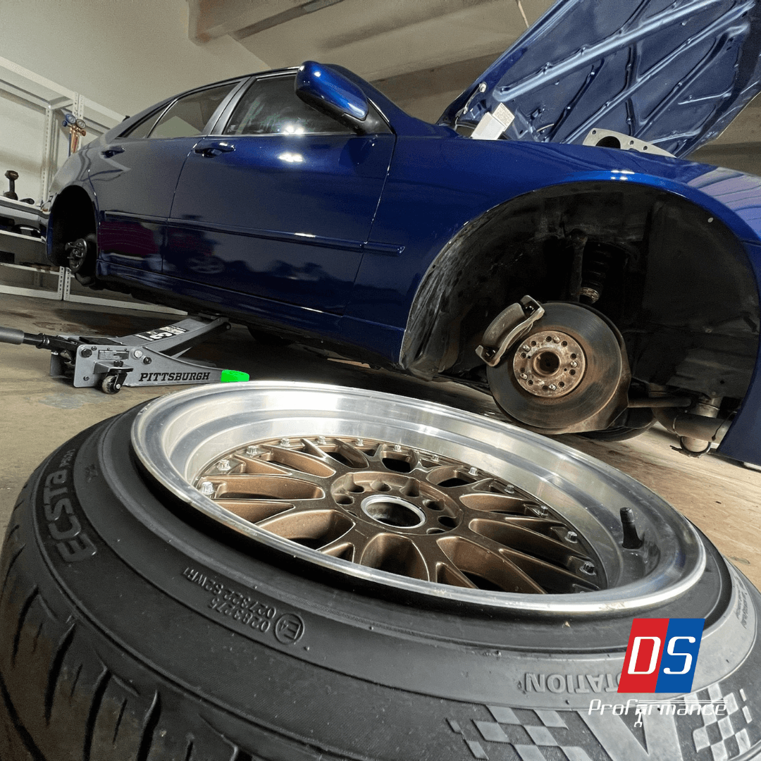 Blue sedan undergoing brake service at DS Proformance Blue sedan undergoing brake service at DS Proformance